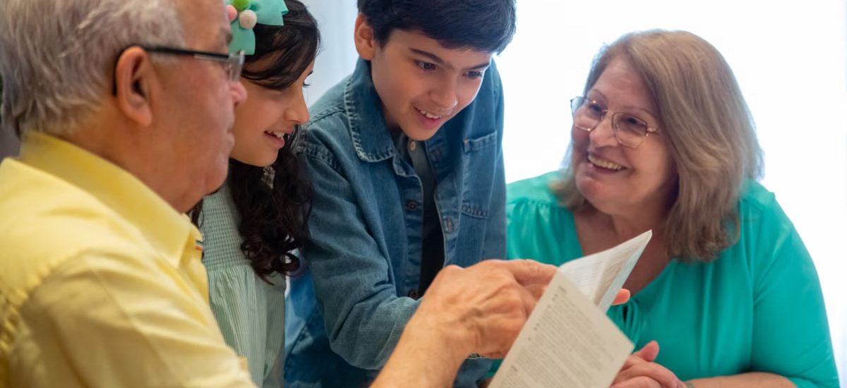 Happy family moments with grandparents and grandchildren enjoying time together indoors.