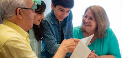 Happy family moments with grandparents and grandchildren enjoying time together indoors.
